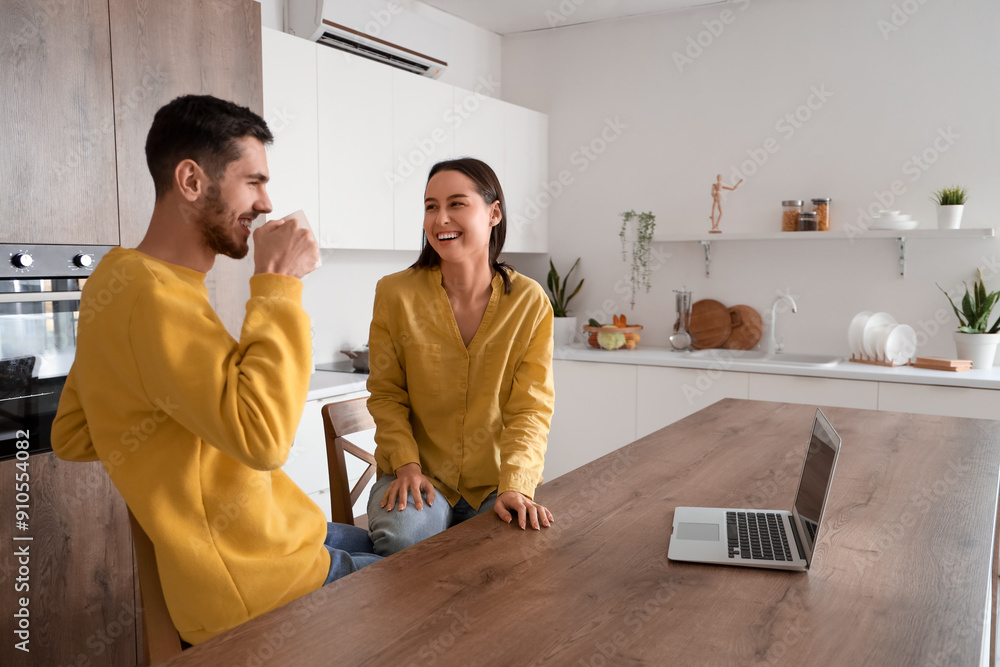 Happy young couple spending time together at home