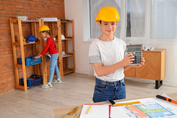 Poster - Little architect with calculator in room