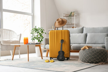 Wall Mural - Suitcase and beach accessories in interior of living room