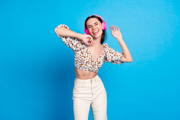 Canvas Print - Photo of pretty young woman headphones dance wear top isolated on blue color background