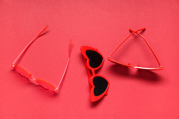 Sticker - Heart-shaped sunglasses on red background