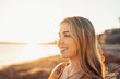 © Daniel - Portrait of one young woman at the beach looking at the sea enjoying free time and freedom outdoors. Having fun relaxing and living happy moments..