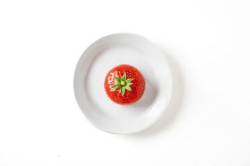 Poster - Single Strawberry on a White Plate