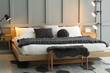 © New Africa - Stylish bedroom interior with comfortable bed and lamps