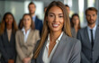 © Surachetsh - A young businesswoman and her team of emerging leaders, confidently posing in a futuristic office environment, symbolizing the evolution of leadership in the family business.