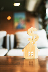 Wall Mural - Symbol Dollar and house sign icon wooden on wood table. Concepts of home interest, real estate, investing in inflation.