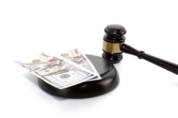 A wooden gavel and fake money.