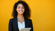 © StockLab - A professional woman in her 30s, smiling at the camera, dressed in business attire, against a light background