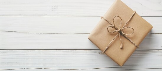 Poster - Elegant gift box displayed on a white wooden surface perfect for a copy space image