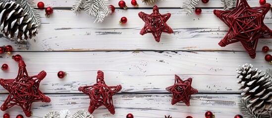 Poster - A festive Christmas scene featuring red rattan stars cones and a white wooden backdrop Ideal for a greeting card with a top down view and space for text or images. Creative banner. Copyspace image