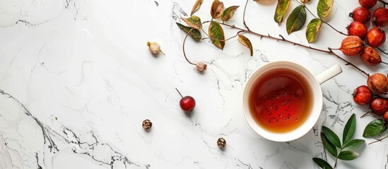 Poster - Rose hip tea and fresh berries arranged on a white marble surface with ample copy space image