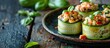 © HN Works - Minced chicken and veggies fill zucchini columns on a plate against a dark wood backdrop with copy space image