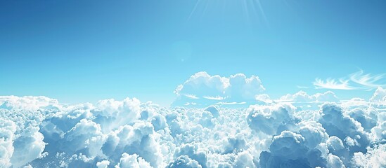 Wall Mural - a large expanse of blue sky with fluffy clouds perfect for a copy space image