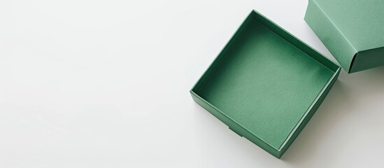 Aufkleber - Green gift box with an open lid made of cardboard placed against a white backdrop to showcase a blank area for text or design serving as a copy space image