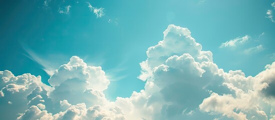 Poster - Scenic view of a blue sky with fluffy white clouds in a copy space image