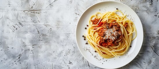 Sticker - Savoring spaghetti bolognese sprinkled with black pepper and salt on a white plate against a textured backdrop with ample copy space for additional elements