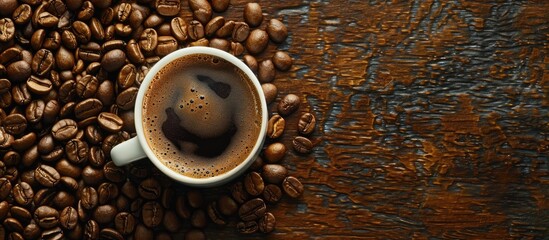 Aufkleber - Overhead view of a cup of coffee with coffee beans around it with copy space image