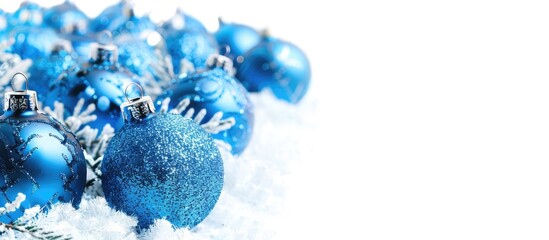 Poster - A vibrant holiday setting with blue Christmas ornaments on a white background camera ready for text inclusion in the copy space image