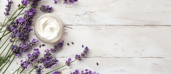 Canvas Print - A white wooden table background with cosmetic cream product samples and lavender leaves offering ample copy space image