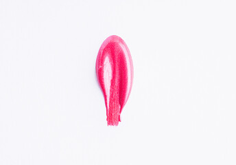 Poster - Pink shimmer swatch of lip gloss, cosmetic product stroke or paint, macro. Swatches of bright pink lipgloss or paint isolated on white background.