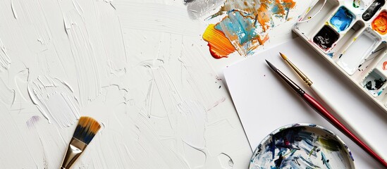 Poster - Drawing on a white background with a brush and notepad with a copy space image available