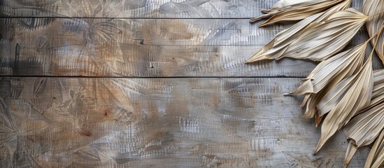 Dried palm leaves used for ancient manuscripts on a wooden background perfect as a writing material back then with a blank copy space image for text shown from top and side views