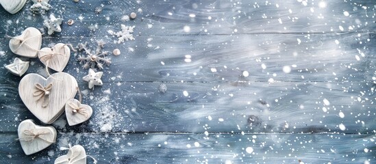 Fototapete - Festive greeting card with a snowfall effect features white wooden hearts snowflakes and ample copy space for an image in a Christmas and New Year theme