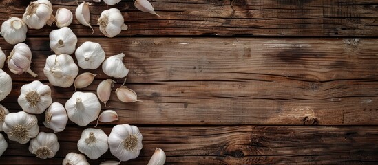 Aufkleber - Top view of garlic displayed on a rustic wooden background with ample copy space image