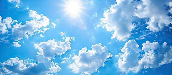 Poster - Sunny day with blue skies and white clouds offer an abstract background for a copy space image