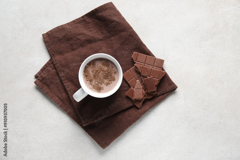 Cup of sweet chocolate milk on white background