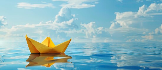 Poster - A yellow origami boat floats on the blue lake water heading towards big dreams symbolizing summer travel and freedom against a sky background with a copy space image