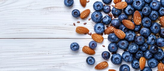 Aufkleber - Top view of a white wooden background with a breakfast oatmeal featuring blueberries and almonds providing copy space image