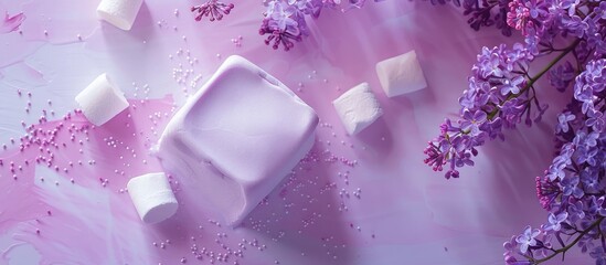 Aufkleber - Top view of a homemade marshmallow in violet color set against a background of lilac flowers and zephyr ideal for copy space image