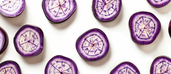 Poster - Eggplant slices arranged in circular pattern on white backdrop Isolated with copy space image for decorative frame or border on a food themed background