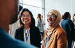 © Jacob Lund - Female colleagues interacting at a corporate workshop with happy smiles and engaging conversations