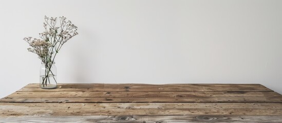 Aufkleber - A wooden table resting against a white wall creates a simple and elegant backdrop for any object with ample copy space image