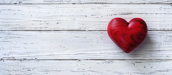 Poster - A chic red heart lays flat on a white wooden surface for a Valentine s Day theme It s suitable for a greeting card with copy space image for text ideal for weddings or birthdays