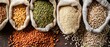 © Only AI Studio - Various grains and legumes in burlap sacks, including lentils, green peas, rice, and oats, displayed on a wooden surface.