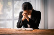 © David - Hands folded in prayer on a Holy Bible in church concept for faith, spirituality and religion, woman praying on holy bible in the morning. woman hand with Bible praying.