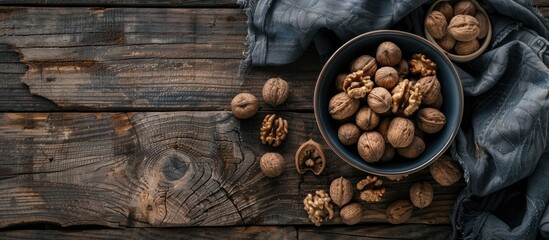 Sticker - Top view of a bowl filled with walnuts on a wooden surface creating a rustic setting perfect for adding text with copy space image