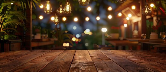 Poster - At a trendy restaurant in the evening a wooden table offers an ideal copy space image for food ads or displays with a lively blurred backdrop