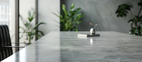 Wall Mural - Office setting with an empty grey marble table showcasing ample copy space image