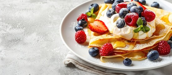 Poster - A white plate with crepes topped with cream cheese fresh berries and honey against a concrete backdrop ideal for adding text or logos. Copy space image. Place for adding text and design