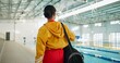 © peopleimages.com - Swimming pool, back or woman at gym for fitness with bag for water sport, hydro exercise or walk. Swimmer, athlete or prepare for training, competition or wellness with practice gear for healthy body