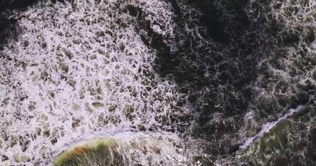 Poster - Waves sea water surface High quality video Bird's eye view, Drone top view waves crashing on sand beach,Nature waves background