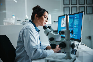 Leinwandbilder - Computer screen, microscope and science with woman in laboratory for development, innovation or research. Data, display and pharmaceuticals with scientist at work on medical breakthrough or discovery