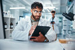 © peopleimages.com - Report, science and tablet with man in laboratory for development, innovation or research. Pharmaceuticals, study and technology with serious scientist at work on medical breakthrough or discovery