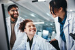 © PeakPoints/peopleimages.com - Science, employees and computer with teamwork, research and online reading with medical cure. Talking, researchers and pc with internet, email and approval for lab funding or collaboration with group