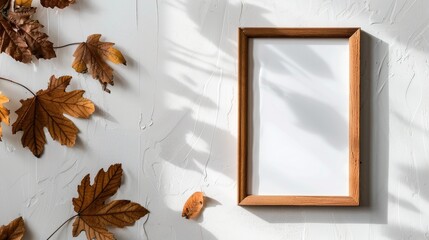 Autumn themed portrait frame on a white wall with space for text