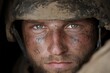 © Milos - This close-up image captures a mud-smeared soldier wearing a helmet, reflecting sheer determination and rugged resilience through their eyes, despite the dirt and harsh conditions.